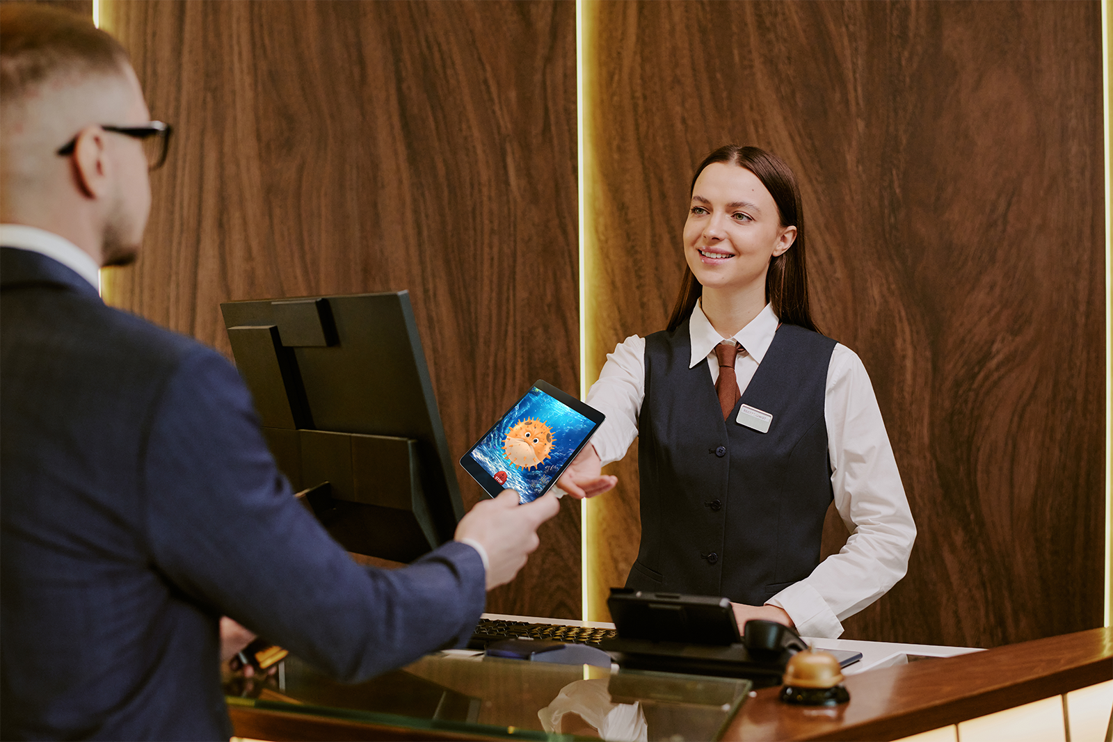 Customer playing a loyalty recognition game at a players club desk